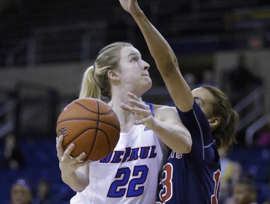 DePauls Brooke Schulte (22) drives against St. Johns Crystal Simmons during the first half of an NCAA womens semifinal Big East tournament game, Monday, March 6, 2017, at the Al McGuire Center in Milwaukee. (AP Photo/Jeffrey Phelps)