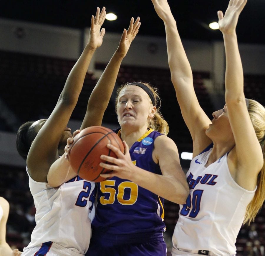 Northern Iowa forward Megan Maahs (50) pulls down a rebound between two DePaul defenders during the first half of a first-round game in the womens NCAA college basketball tournament in Starkville, Miss., Friday, March 17, 2017. (AP Photo/Rogelio V. Solis)