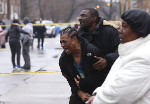 Georgia Jackson, 72, is overcome with emotion upon learning that her two grandsons, Raheem, 19, and Dillon Jackson, 20, were found fatally shot in the South Shore neighborhood in Chicago on Thursday, March 30, 2017. Chicago police said Thursday several people were found fatally shot Thursday in or near a restaurant. (Chris Sweda/Chicago Tribune via AP)