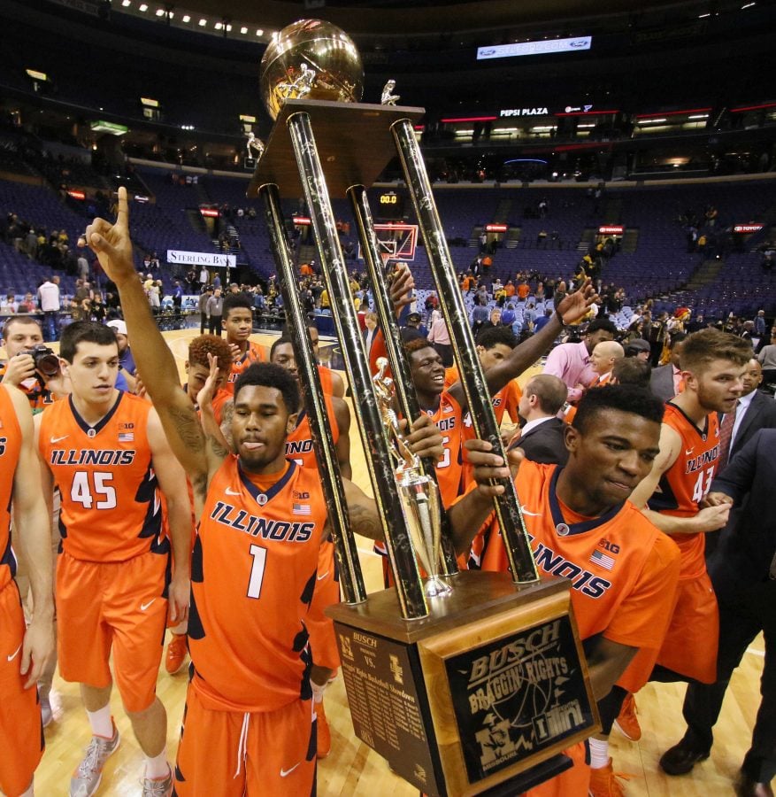 Illinois guards Jaylon Tate, left, and Aaron Jordan carry the Busch Braggin Rights trophy, the spoils of a 69-63 win against Missouri on Wednesday, Dec. 23, 2015, at the Scottrade Center in St. Louis. Illinois won, 68-63. (Chris Lee/St. Louis Post-Dispatch/TNS)