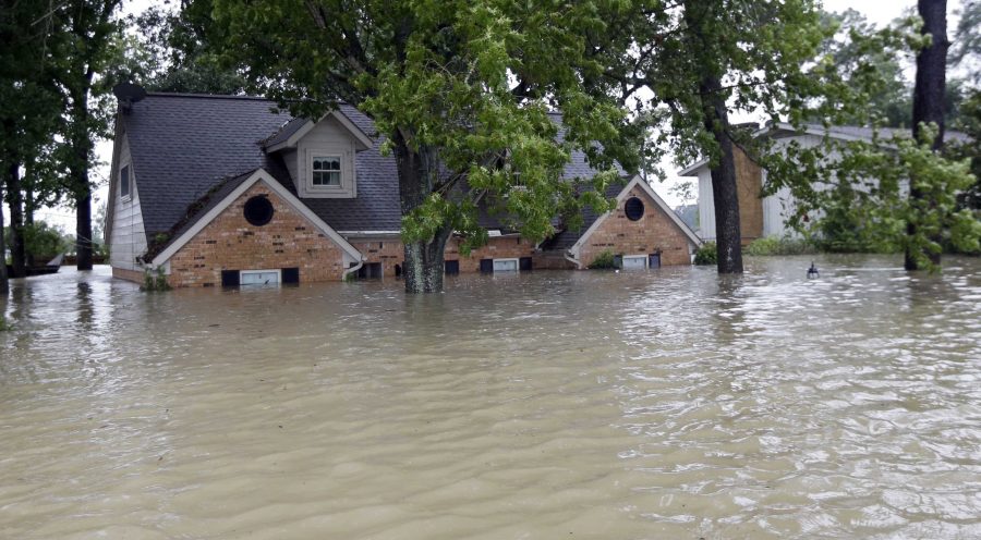 A home in Houston, Texas is submerged in severe flooding after Tropical Storm Harvey devastated south-central Texas beginning Aug. 25 when it first made landfall.   
(AP Photo/David J. Phillip)