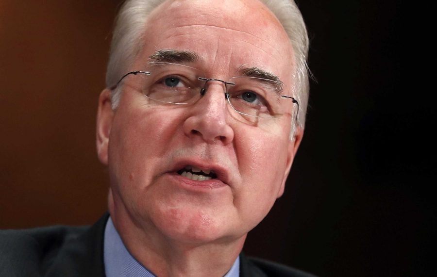 Trump's health secretary resigns in travel flap.
(Darron Cummings/AP)