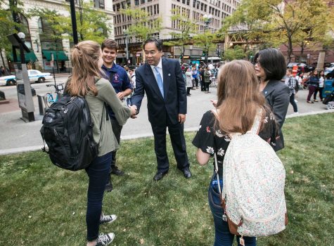 DePaul University President A. Gabriel Esteban, Ph.D., and his wife, Josephine, greet students in Pritzker Park on State Street Wednesday, Sept. 6, 2017. 
(Jamie Moncrief/DePaul University)