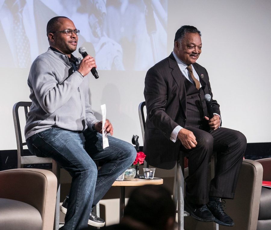 Horace Hall, left, associate professor in the College of Education at DePaul University and civil rights leader, the Rev. Jesse L. Jackson Sr., kick off a discussion at DePaul University. 
