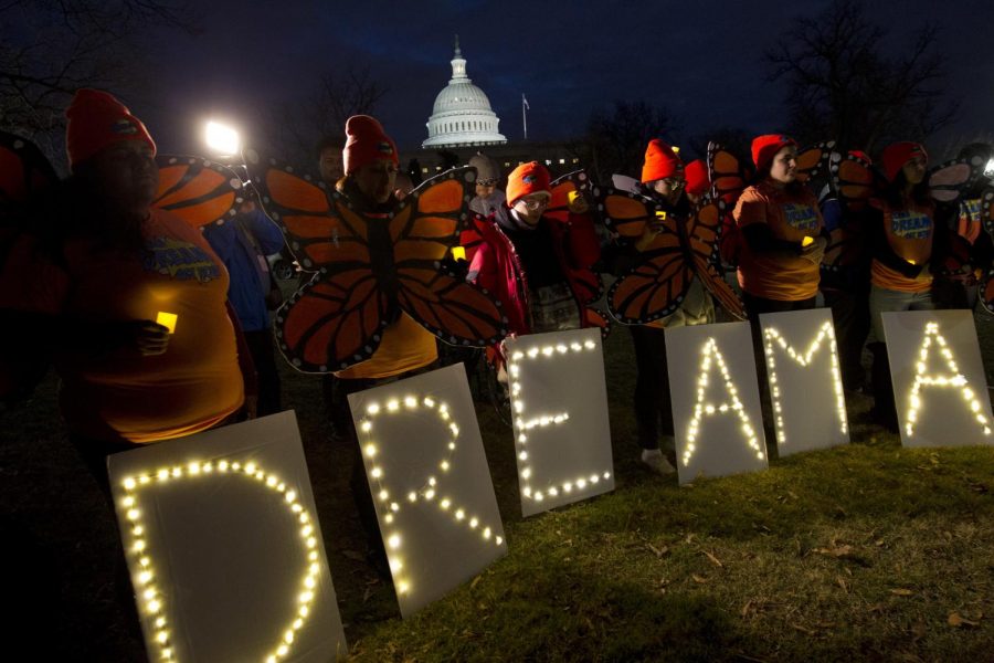 Demonstrators dressed like monarch butterflies hold a vigil outside the Capitol on Jan. 21, the second day of the government shutdown. Sen. Bernie Sanders spoke at the event.  (Photo courtesy of Associated Press)
