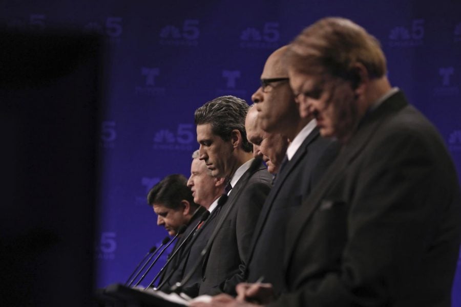 From left to right:  J.B. Pritzker, Chris Kennedy, state Sen. Daniel Biss, Bob Daiber, Tio Hardiman and Robert Marshall.  (Photo courtesy of the  Associated Press)