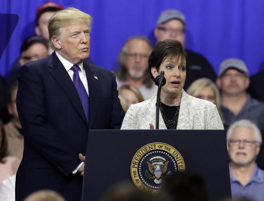 Deana Spoleti speaks as President Donald Trump listens during a speech a visit to Sheffer Corporation, Monday, Feb. 5, 2018, in Blue Ash, Ohio. (AP Photo/Evan Vucci)