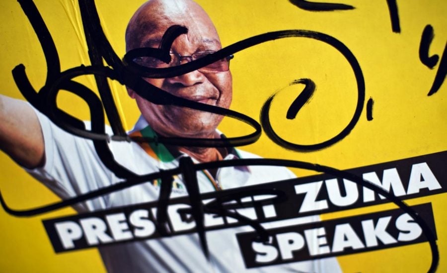 An+election+poster+of+former+President+Jacob+Zuma+is+defaced+in+the+downtown+area+of+Johannesburg%2C+South+Africa+in+this+May+2%2C+2014+photo.+Zuma+resigned+after+pressure+from+his+party+amid+scandals+that+came+up+during+his+time+in+office.+%28Ben+Curtis+%7C+Associated+Press%29