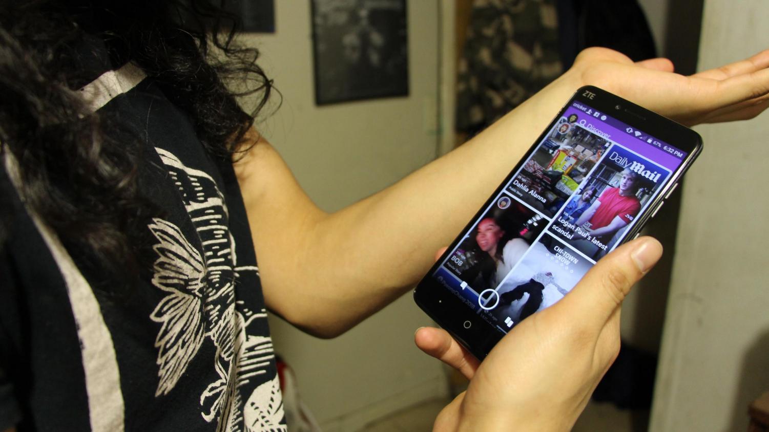 A confused Snapchat user attempts to make sense of the recent update to the app’s user interface, specifically the new