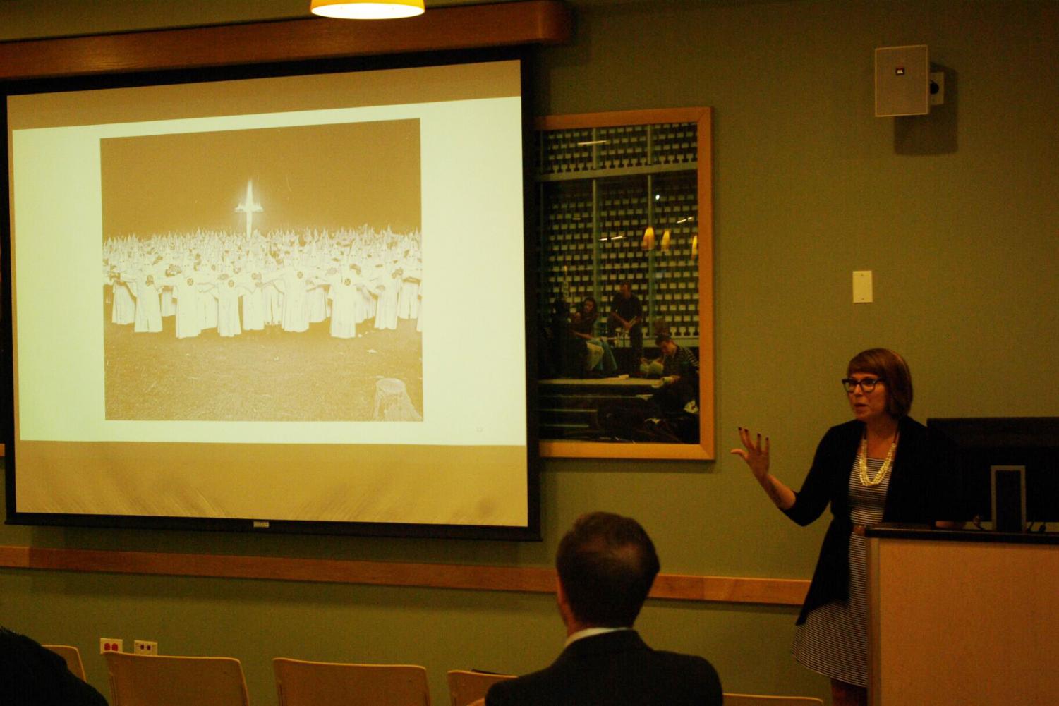 Kelly Baker says burning crosses has double symbolism, both that Christ is the light of the world, and as a warning to minorities or other religions.