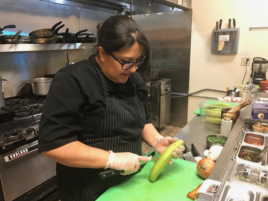 At Casa Yari, head chef Yari Vargas chops plantains, onions and cilantro to prepare traditional Latinx dishes from scratch. The 'jibarito,' in particular, is a Chicago-Rican classic.
(Amber Colón | The DePaulia)
