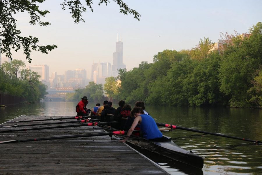 DePaul's six-year-old crew club gathers into their 60-foot boat and pushes off the dock for practice along the Chicago River. 