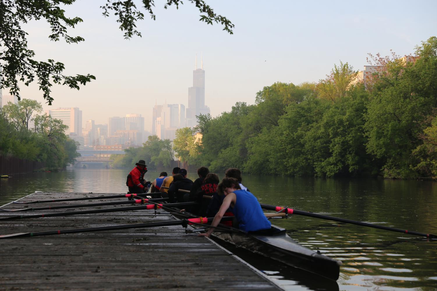 DePaul's six-year-old crew club gathers into their 60-foot boat and pushes off the dock for practice along the Chicago River.