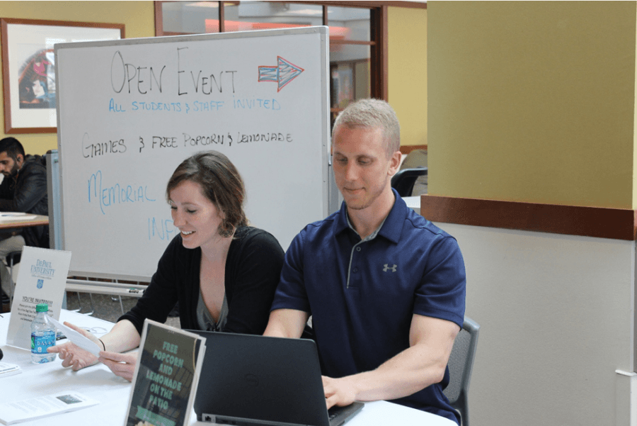 Veteran Liaisons, Bridget M. Keane (left) and Daniel Eggensammer (right), members of the Office of Veteran Affairs, working the Memorial Day informational and games event.

