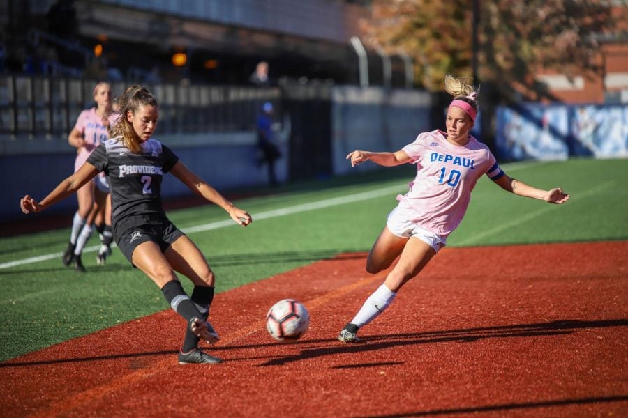 DePaul forward Franny Cerny and Providence defender Hailee Duserick fight for the ball on Thursday at Wish Field. The Demons tied Providence 0-0 in double OT.
Mairead Khan  | The DePaulia