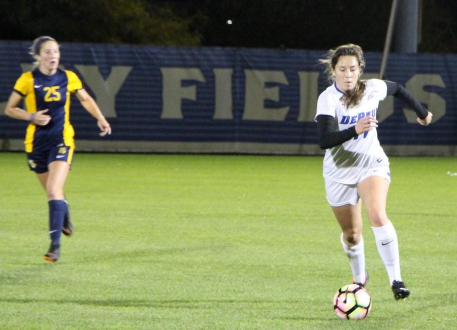 DePaul senior midfielder Madeline Frick controls the ball as Marquette senior midfielder Leah Celarek looks on during the first half of a 0-0 tie between DePaul and Marquette. 
Andrew Hattersley | The DePaulia