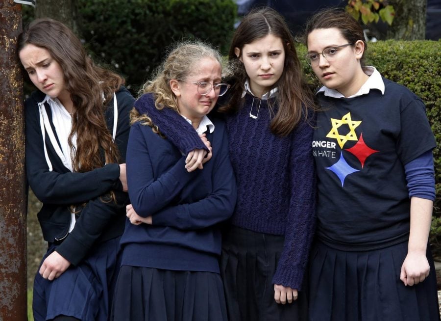 Students from a school near Squirrel Hill react following a funeral service at the Jewish Community Center on Tuesday Oct. 30, 2018.