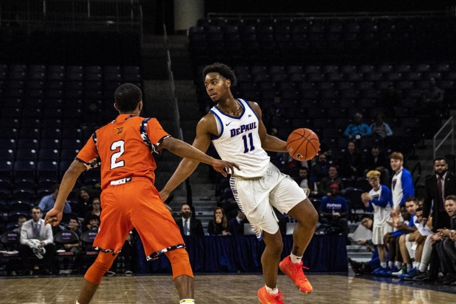 Senior guard Eli Cain dribbles against Morgan State guard Martez Cameron. 
Richard Bodee | The DePaulia