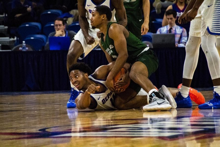 DePaul senior Eli Cain dives for a loose ball during the Blue Demons 83-73 win against Cleveland State Wednesday. Richard Bodee I The DePaulia 