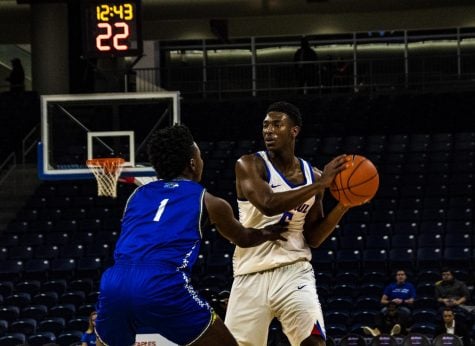 DePaul junior guard Jalen Coleman-Lands takes on Rockhurst defender Tyler Garrett. 
Richard Bodee | The DePaulia