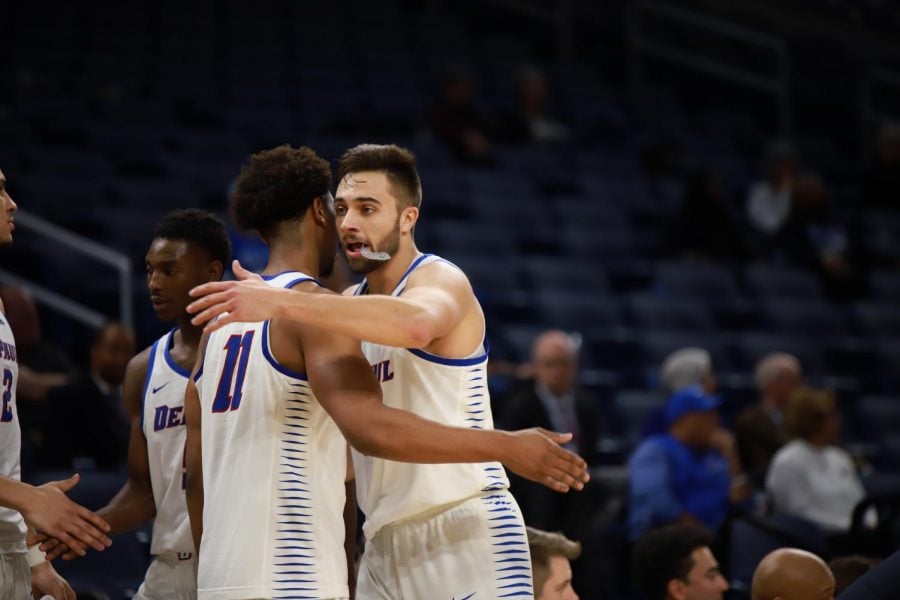 DePaul seniors Eli Cain and Max Strus celebrate the Blue Demons 80-58 victory over Bethune-Cookman on Wednesday night. 