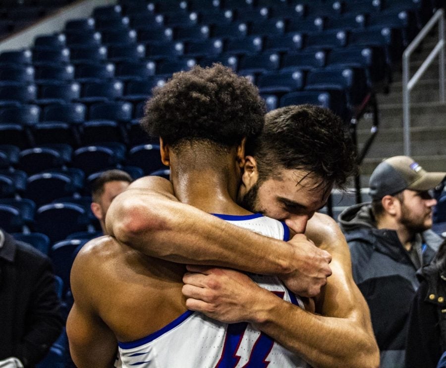 Seniors Eli Cain and Max Strus embrace after a 72-70 win against Penn State Thursday night. Richard Bodee | The DePaulia