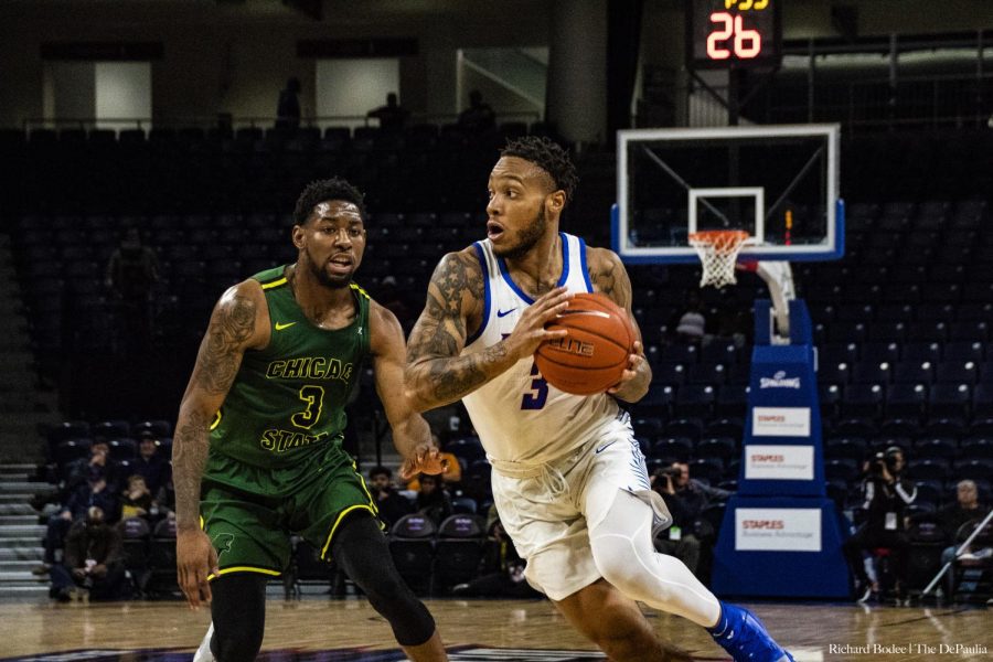 DePaul sophomore guard Devin Gage drives past Chicago State guard Savon Bell Wednesday night at Wintrust Arena. Richard Bodee | The DePaulia 