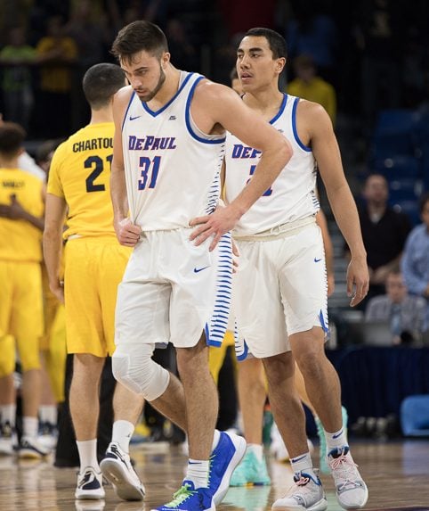 Senior guard Max Strus and freshman guard Flynn Cameron walk off the court following DePauls 92-73 loss to Marquette Tuesday night. Will Barksdale | The DePaulia