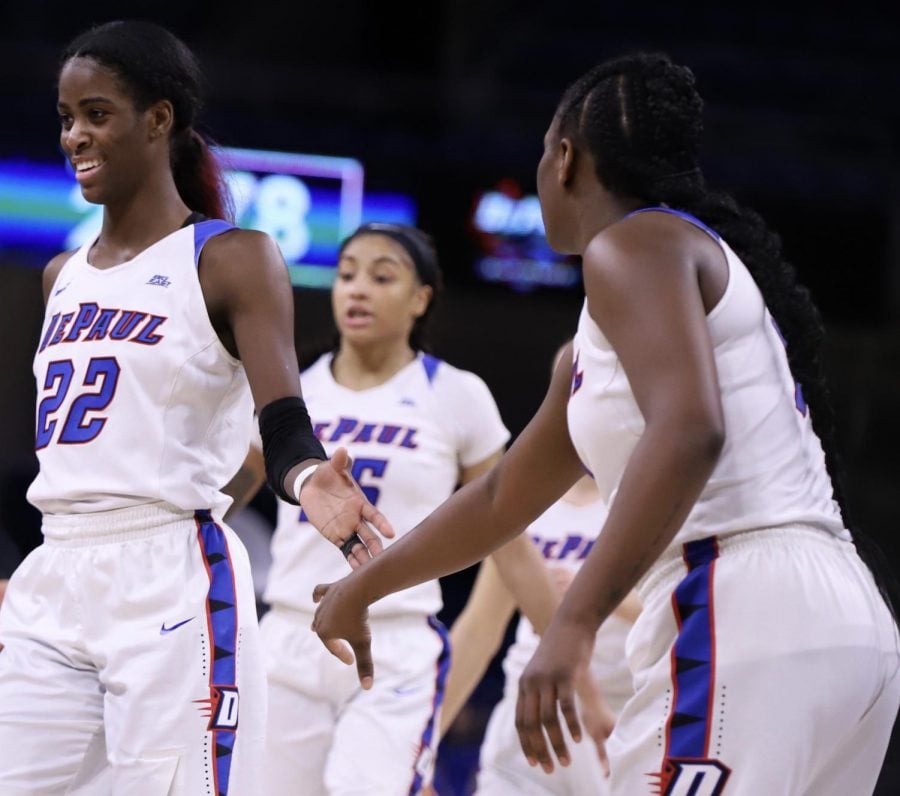 DePaul’s Chante Stonewall, Mart’e Grays and Ashton Millender celebrate a play Monday night at Wintrust Arena. The Blue Demons advanced to the Big East Tournament championship game with an 80-69 victory over Creighton and will face Marquette for the third straight season. Alexa Sandler | The DePaulia