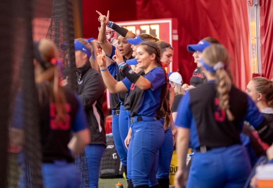 The DePaul bench celebrates a hit during a Feb. 9 game against Green Bay at the Total Control Sports Invitational. The Blue Demons went on to win game 10-1. 