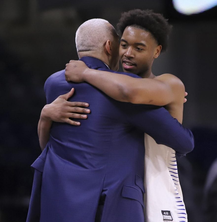 DePaul senior guard Eli Cain hugs head coach Dave Leitao at the end of the Blue Demons 101-69 win over Georgetown on March 6 at Wintrust Arena. Cain finished with 24 points and five assists as he scored at least 20 points for the fourth time this season. 