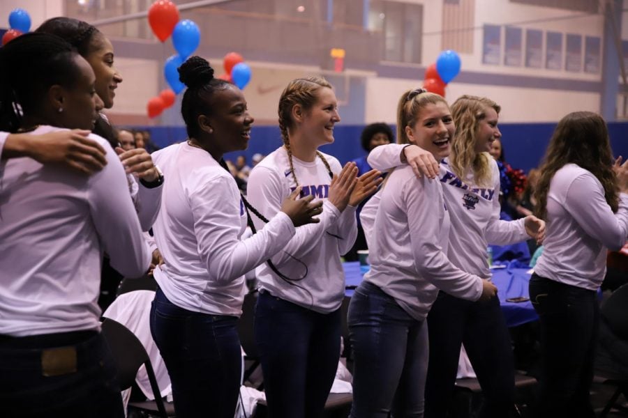 DePaul players celebrate the program's 17th consecutive NCAA Tournament berth Monday night at McGrath-Phillips Arena. Xavier Ortega | The DePaulia