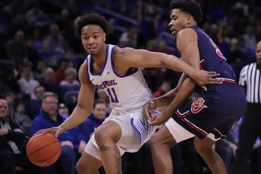 DePaul senior guard Eli Cain dribbles past St Johns guard Justin Simon during DePauls win over St. Johns Sunday afternoon at Wintrust Arena. Alexa Sandler | The DePaulia