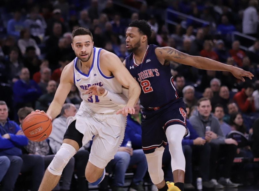 DePaul senior guard Max Strus drives past St John's guard Shamorie Ponds, who signed as an undrafted free agent with the Houston Rockets, during Sunday's game against St. John's at Wintrust Arena. Alexa Sandler | The DePaulia