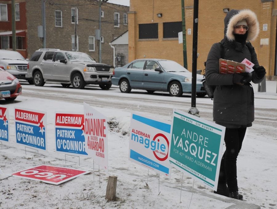 Megan Hyska, a volunteer for Ugo Okere, waits for people to walk by so she could talk about voting in the aldermanic candidate for the 40th ward of Chicago.