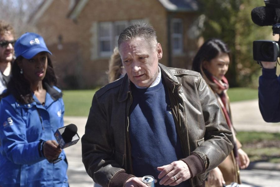 Andrew Freund Sr., the father of the missing 5-year-old Andrew AJ Freund, walks near his home on Dole Avenue in Crystal Lake, Ill. on Friday, April 19, 2019 as members of the media try to speak with him. Police are investigating the boys disappearance and are focusing their attention on the boys home.