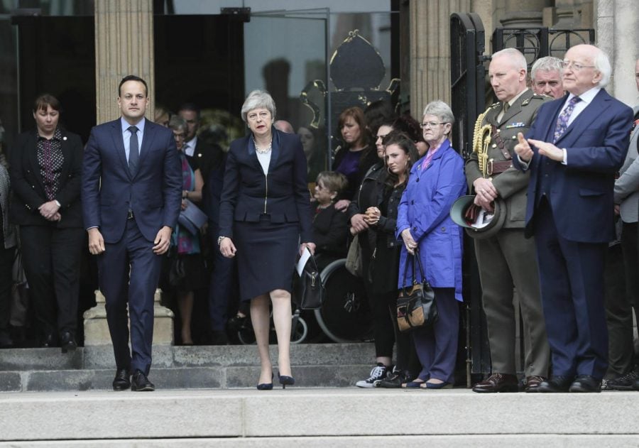 Britain's Prime Minister Theresa May, centre and Ireland Prime Minister Leo Varadkar leave after the funeral service of journalist Lyra McKee, at St Anne's Cathedral in Belfast, northern Ireland, Wednesday April 24, 2019. The leaders of Britain and Ireland joined hundreds of mourners Wednesday at the funeral of Lyra McKee, the young journalist shot dead during rioting in Northern Ireland last week.