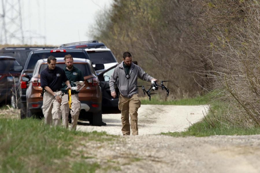 McHenry County Sheriffs officers and other law enforcement search the area of Route 176 and Dean Street south of Woodstock, Ill., for clues in the disappearance of 5-year-old missing boy Andrew AJ Freund, Wednesday, April 24, 2019.
