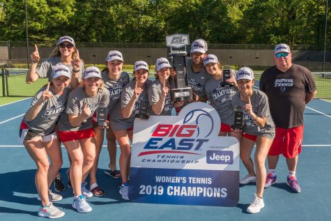 The DePaul womens tennis team pose for a picture together after winning the Big East Tournament championship. The Blue Demons defeated Xavier 4-3 in the final on April 22 in South Carolina. 