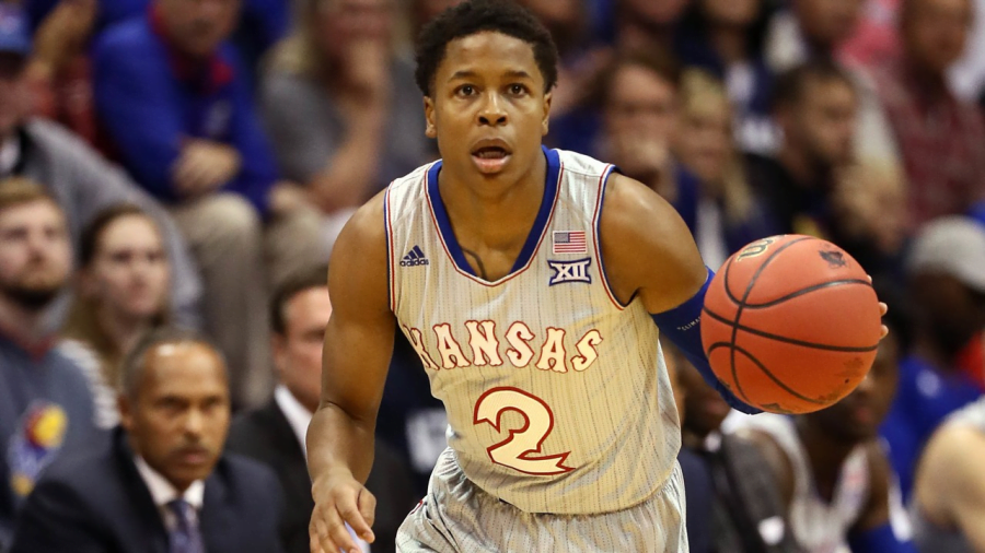 Charlie+Moore+brings+up+the+ball+for+Kansas+earlier+this+season.+Moore+announced+his+transfer+from+Kansas+to+DePaul+on+April+22.+