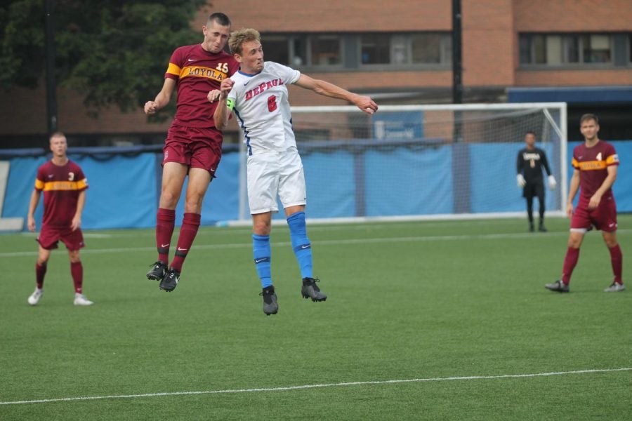 DePaul senior Harry Hilling and Loyola Connor Stevenson go up for a header in their game at Wish Field on Sep. 18, 2018. The Blue Demons lost that game 1-0 in overtime.