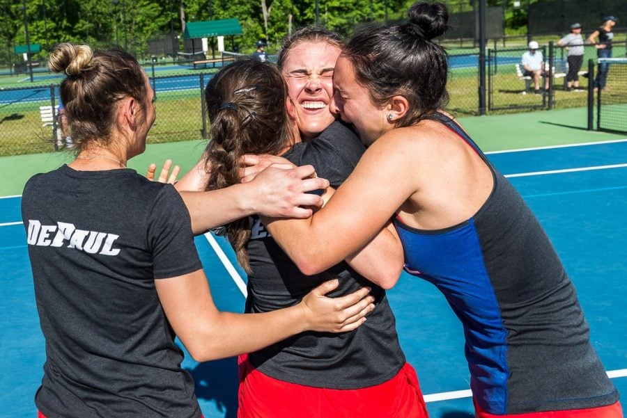 Three+DePaul+womens+tennis+players+celebrate+together+after+winning+the+Big+East+Tournament+on+April+22+in+South+Carolina.+DePaul+defeated+Xavier+4-3+in+the+finals.