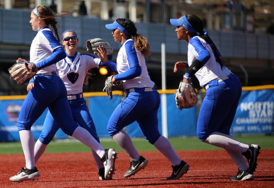 (Left to right) Skylor Hilger, Angela Scalzitti, Erin Andris and Morgan Greenwood celebrate the end of an inning against Providence at Cacciatore Stadium on April 13. 