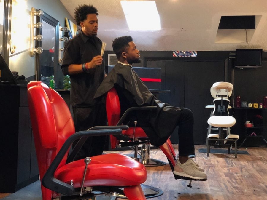 Thomas getting ready to treat Ola to a haircut inside of the haircut section of his studio in Lincoln Park, on Feb. 2, 2019.