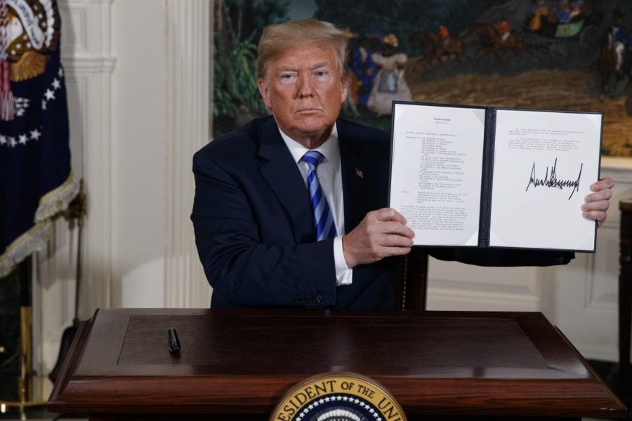 In this May 8, 2018 file photo President Donald Trump shows a signed Presidential Memorandum after delivering a statement on the Iran nuclear deal from the Diplomatic Reception Room of the White House. Iranian President Hassan Rouhani is reportedly set to announce Wednesday, May 8, 2019, ways the Islamic Republic will react to continued U.S. pressure after President Donald Trump pulled America from Tehran’s nuclear deal with world powers.