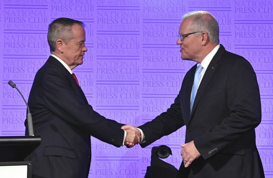 Australian Prime Minister Scott Morrison, right, and Bill Shorten, leader of the federal opposition, shake hands before the third leaders debate at the National Press Club in Canberra, Wednesday, May 8, 2019. Australia will have a national election on May 18.