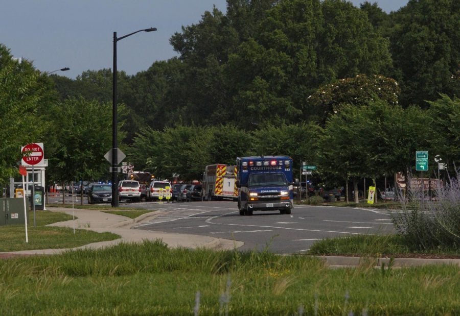 Emergency vehicles respond near the intersection of Princess Anne Road and Nimmo Parkway following a shooting at the Virginia Beach Municipal Center on Friday, May 31, 2019, in Virginia Beach, Va. At least one shooter wounded multiple people at a municipal center in Virginia Beach on Friday, according to police, who said a suspect has been taken into custody. 