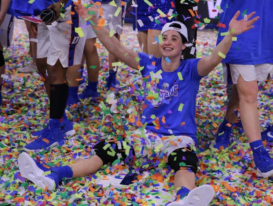 DePaul senior guard Rebekah Dahlman celebrates in confetti after winning the Big East Tournament on March 12 in Wintrust Arena.