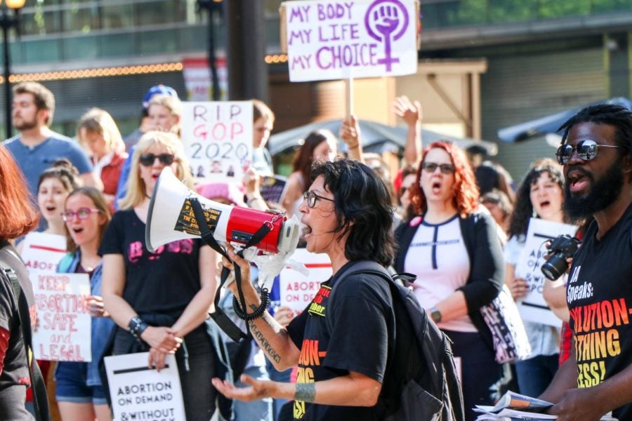Maya Cruz, a supporter of communist group Revolution Club,  spiritedly addresses the crowd at the pro-choice Chicago Rally for Reproductive Justice on Thursday.