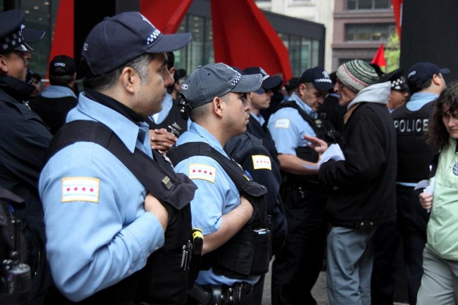 Chicago police officers look on at the Occupy May Day protest in May 2012. 